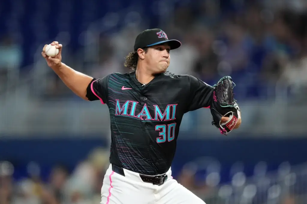 Miami Marlins starting pitcher Tyler Phillips throws to the plate...