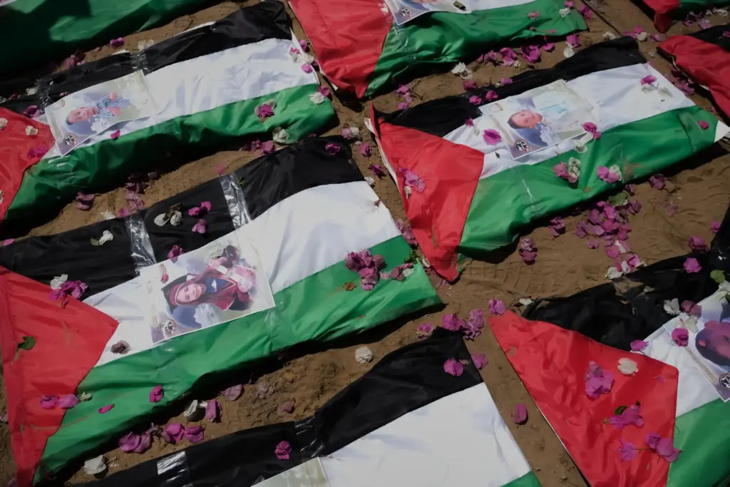 Bodies of members of the Hassayna and Abu Sharia families,...