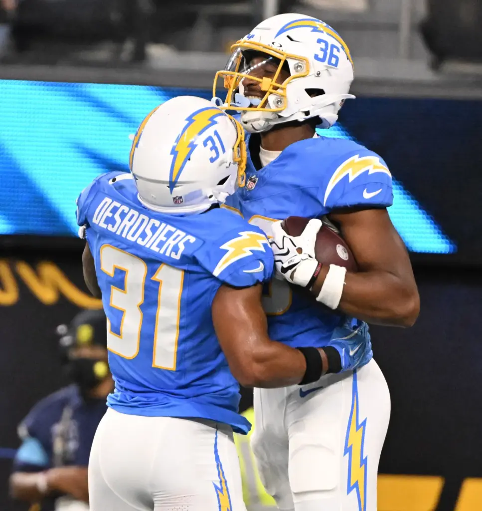 Chargers tight end Jerand Bradley, right, celebrates with running back...
