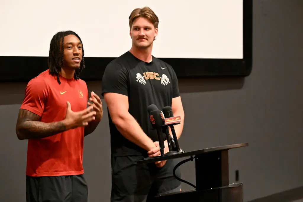 Kilian O’Connor, right, and Christian Pierce speak to the media...