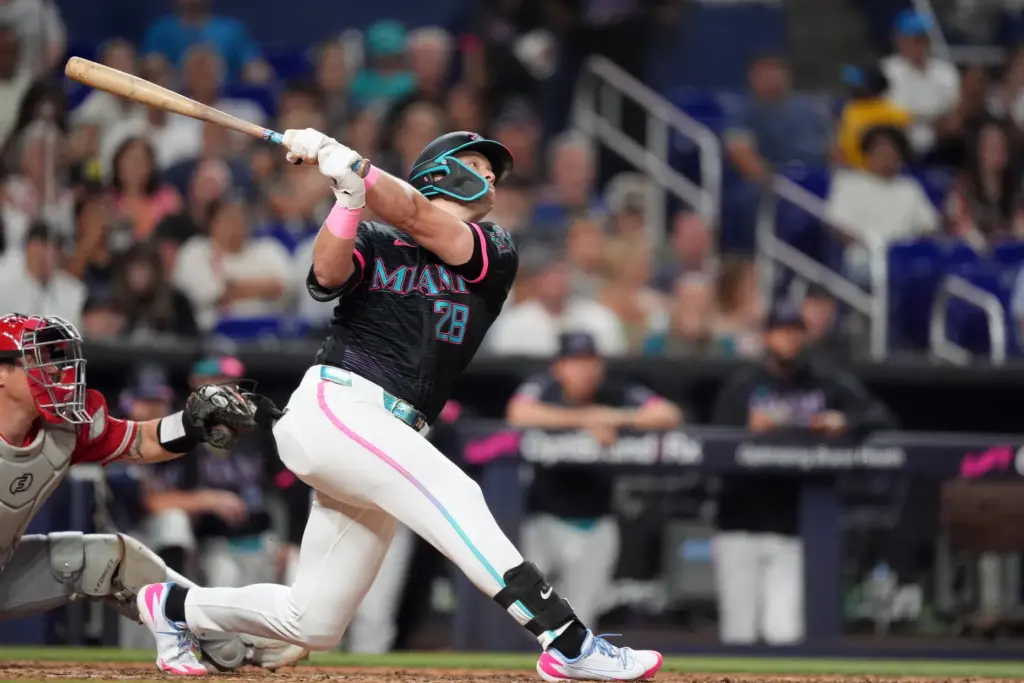 The Miami Marlins’ Kyle Stowers watches his ball after hitting...