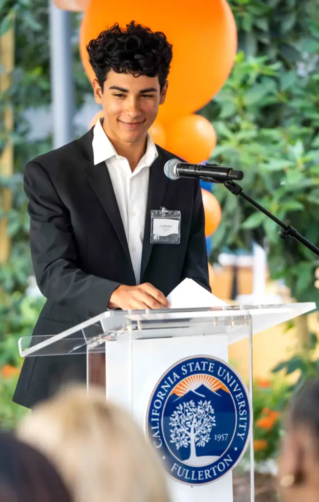 Associated Students President Cesar Mendoza speaks during the grand opening...
