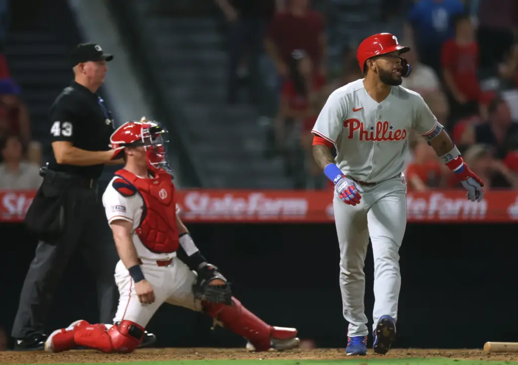 The Philadelphia Phillies’ Edmundo Sosa, right, watches the flight of...