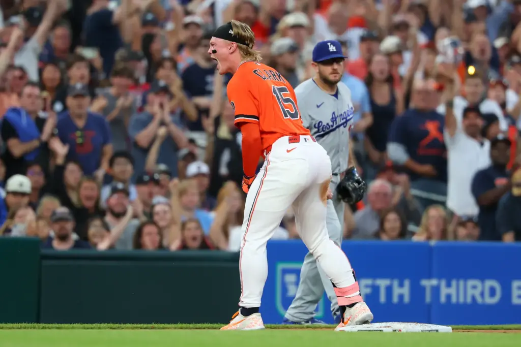 The Detroit Tigers’ Max Clark celebrates at third base after...