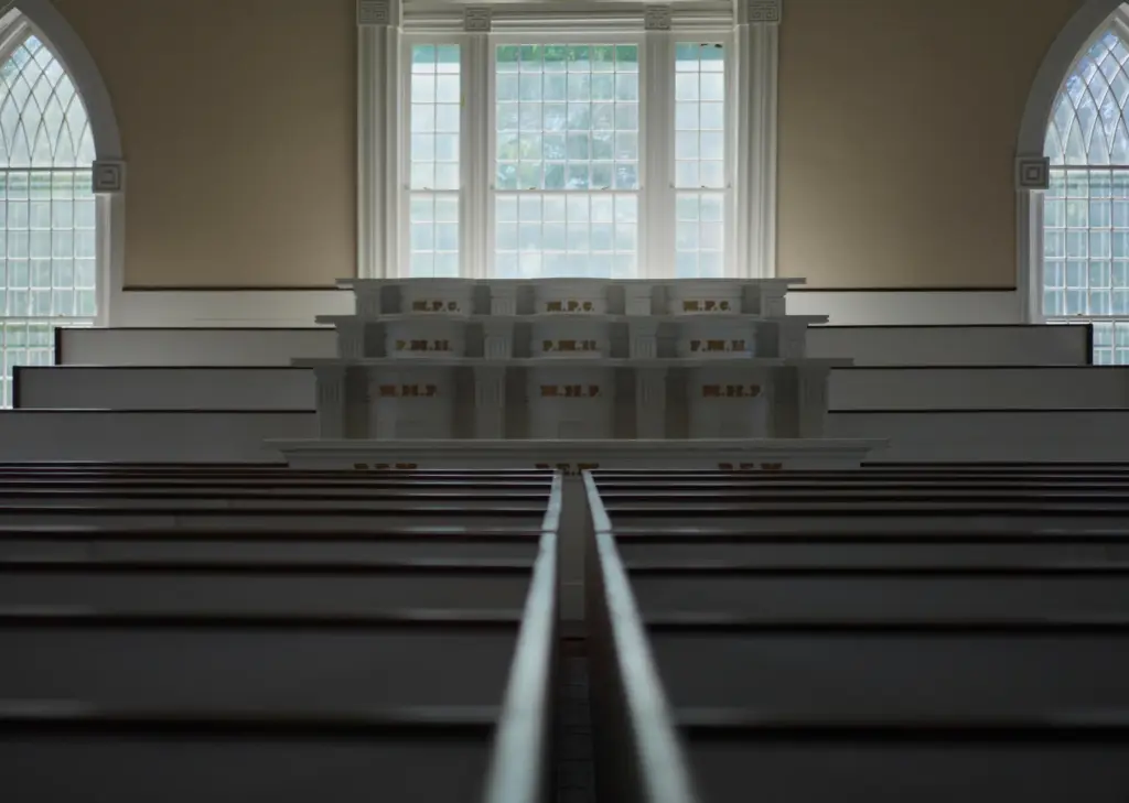 Pew boxes and pulpits in one of two assembly rooms...
