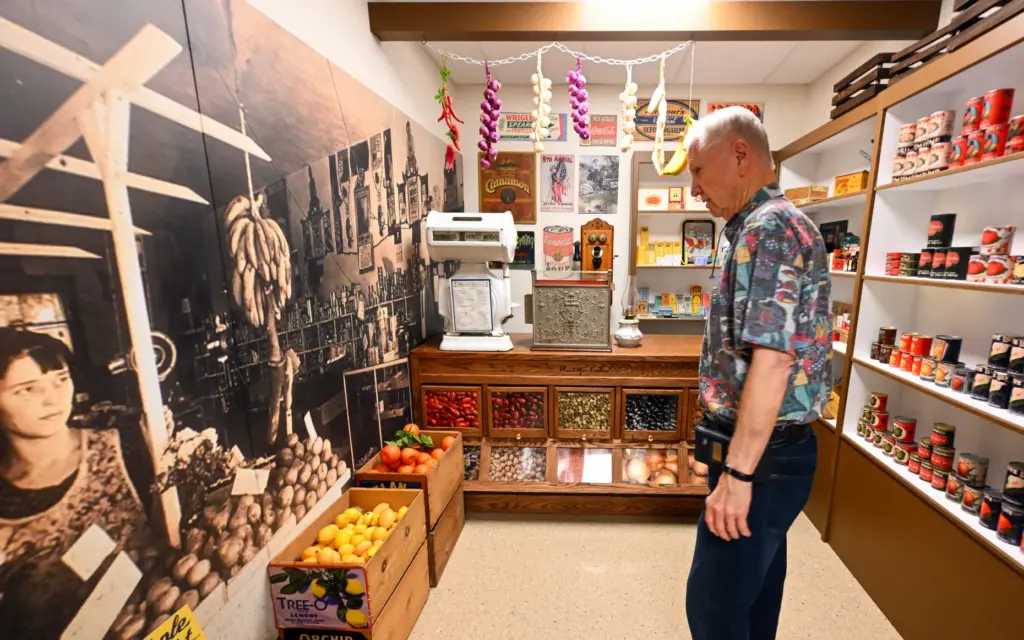Kent Roberts checks out a mural of his great-grandfatherâs market...