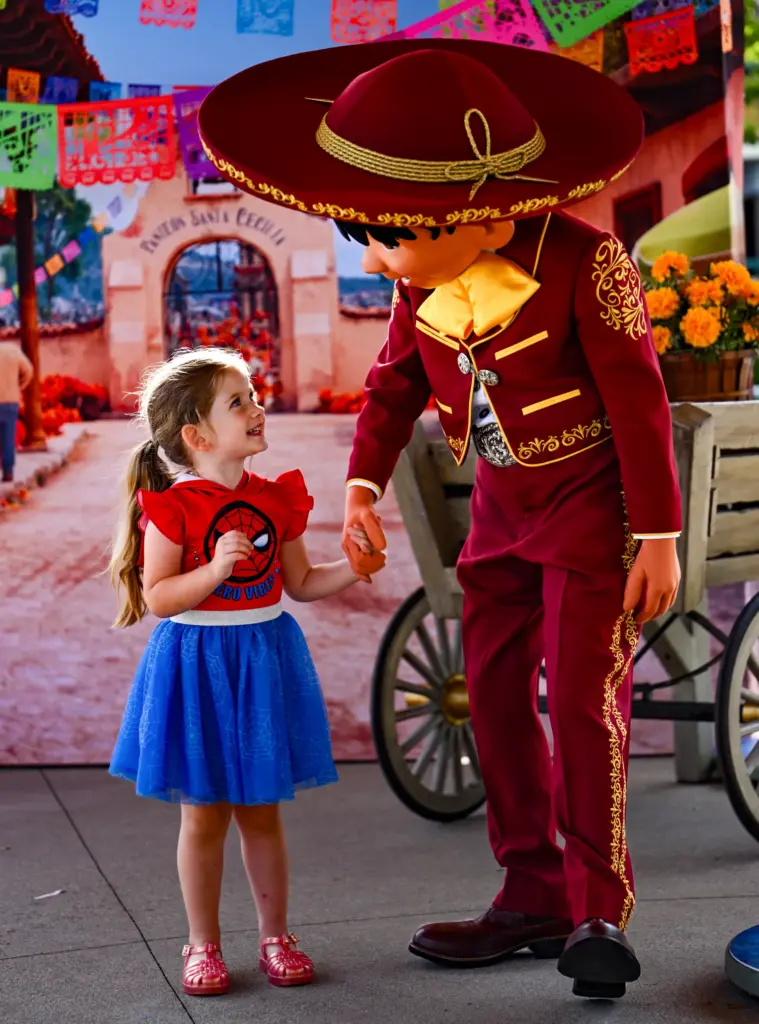 Mabel Walsh, 4, hangs out with Miguel, from Coco, during...