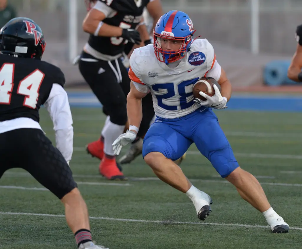 Serra back AJ McBean looks for space to run vs....