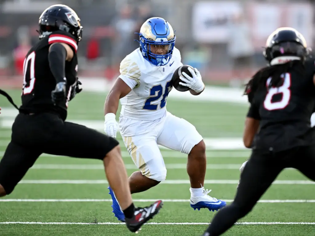 Santa Margarita running back Adrian Petero (26)runs against Centennial in...