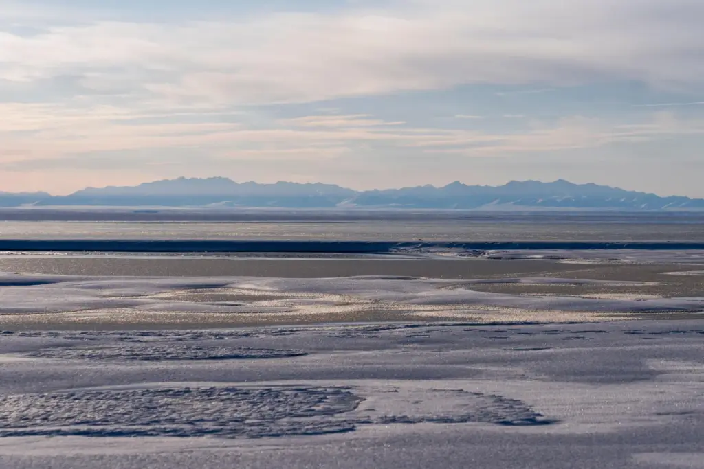 FILE – The Kaktovik Lagoon and the Brooks Range mountains...