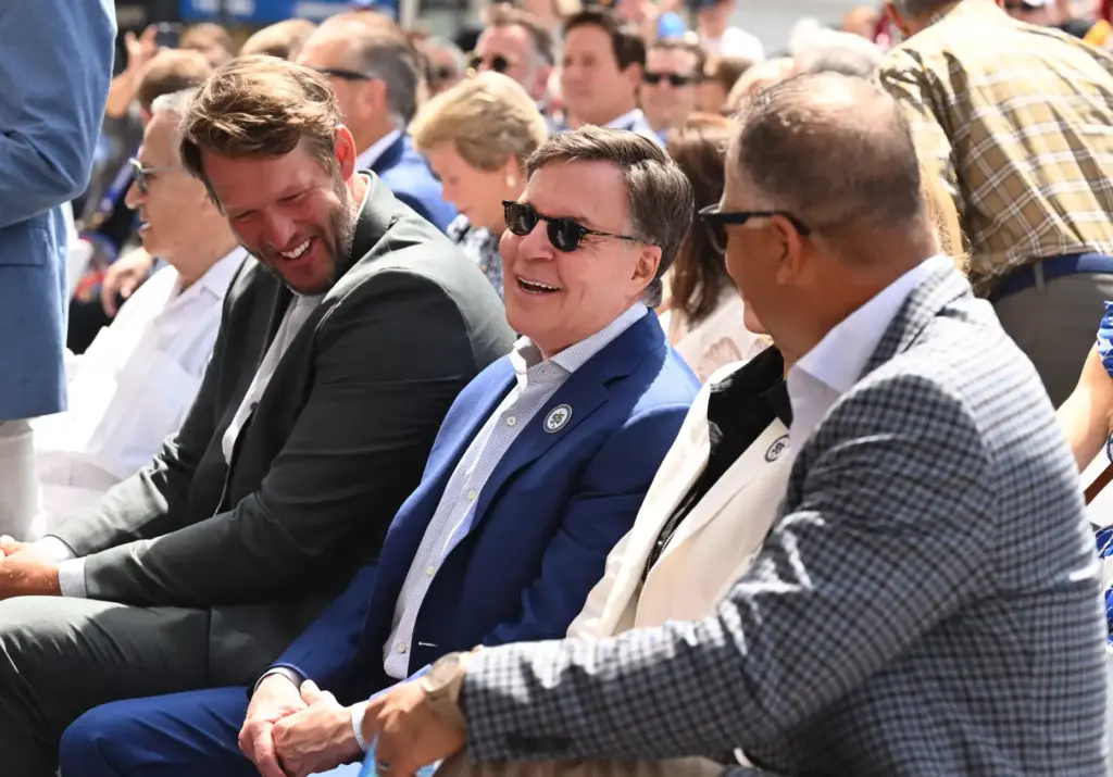 Bob Costas, Clayton Kershaw, left, along with Dave Roberts as...
