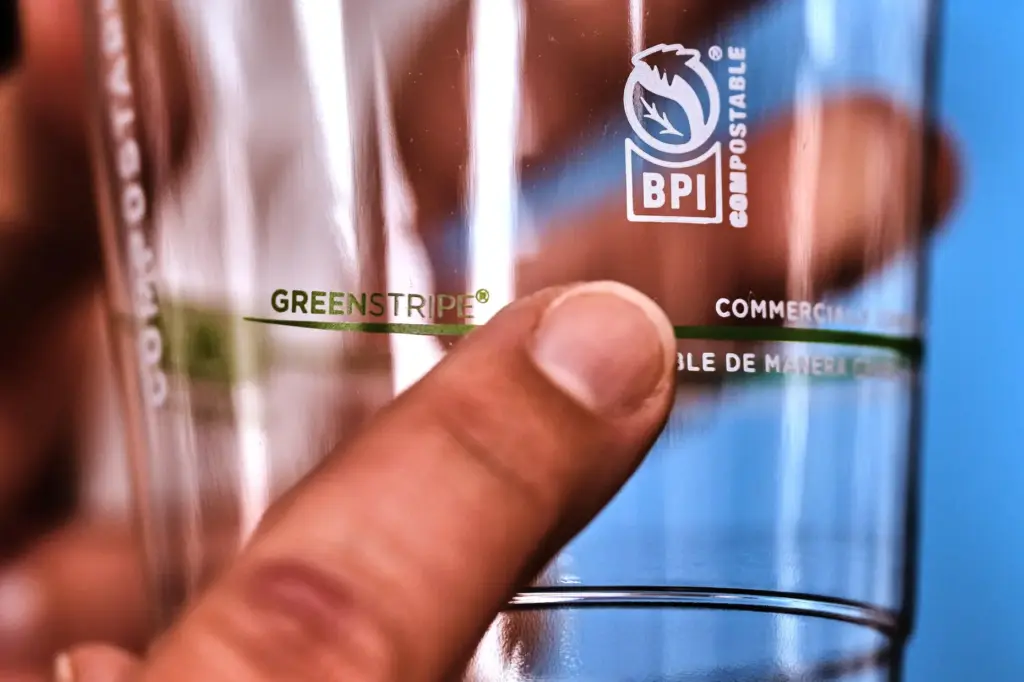 The BPI logo is displayed on a cup made from...