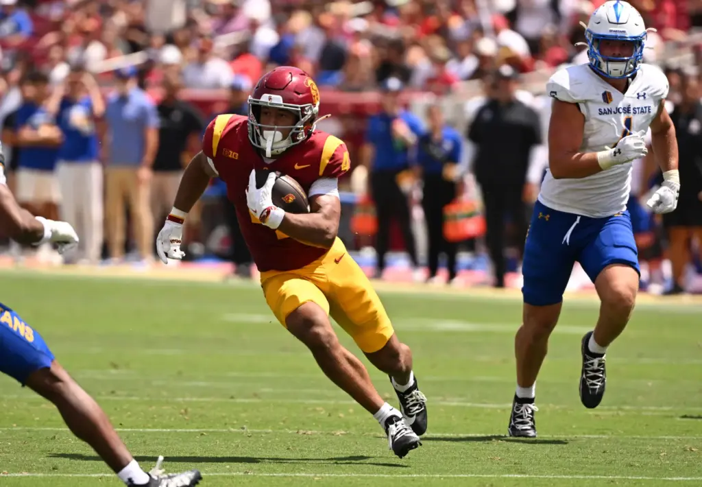 Wide receiver Trent Mosley (4) of the USC Trojans catches...