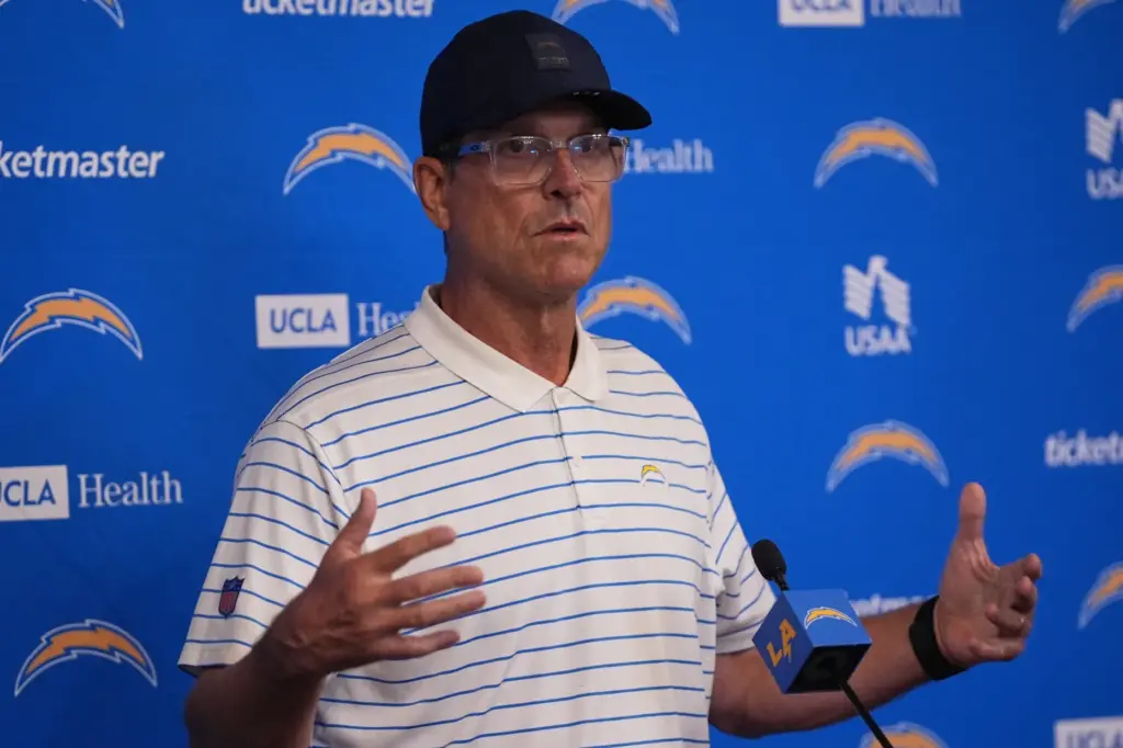 Chargers head coach Jim Harbaugh speaks at a news conference...