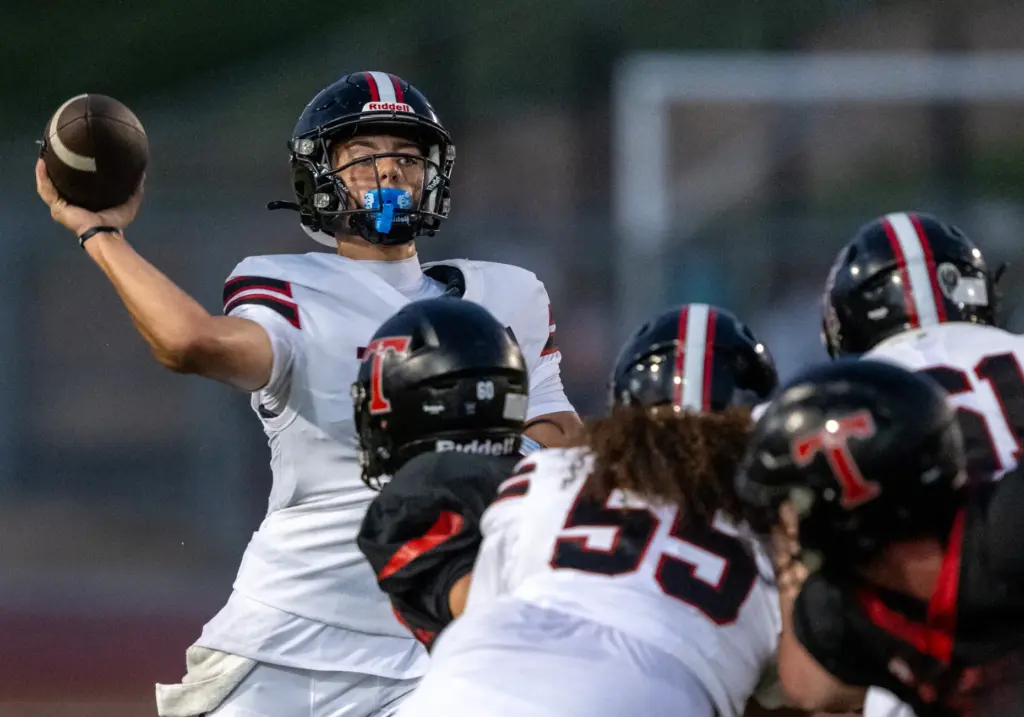 Tustin quarterback Ayden Edwards (3) throws the ball during an...