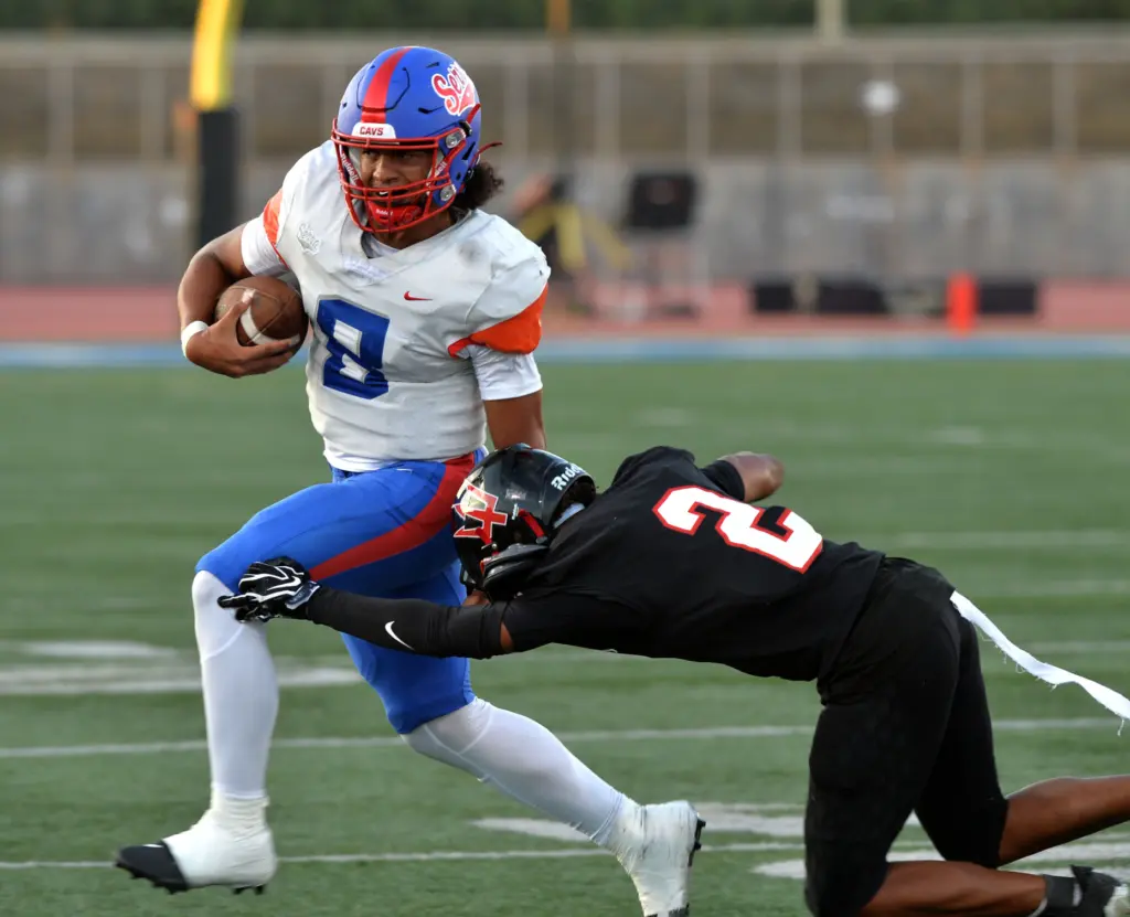 Serra QB Malik Tunai escapes tackle of Palos Verdes DB...