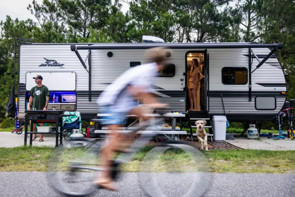 Laura Campbell lets Ivey the dog out of the camper...