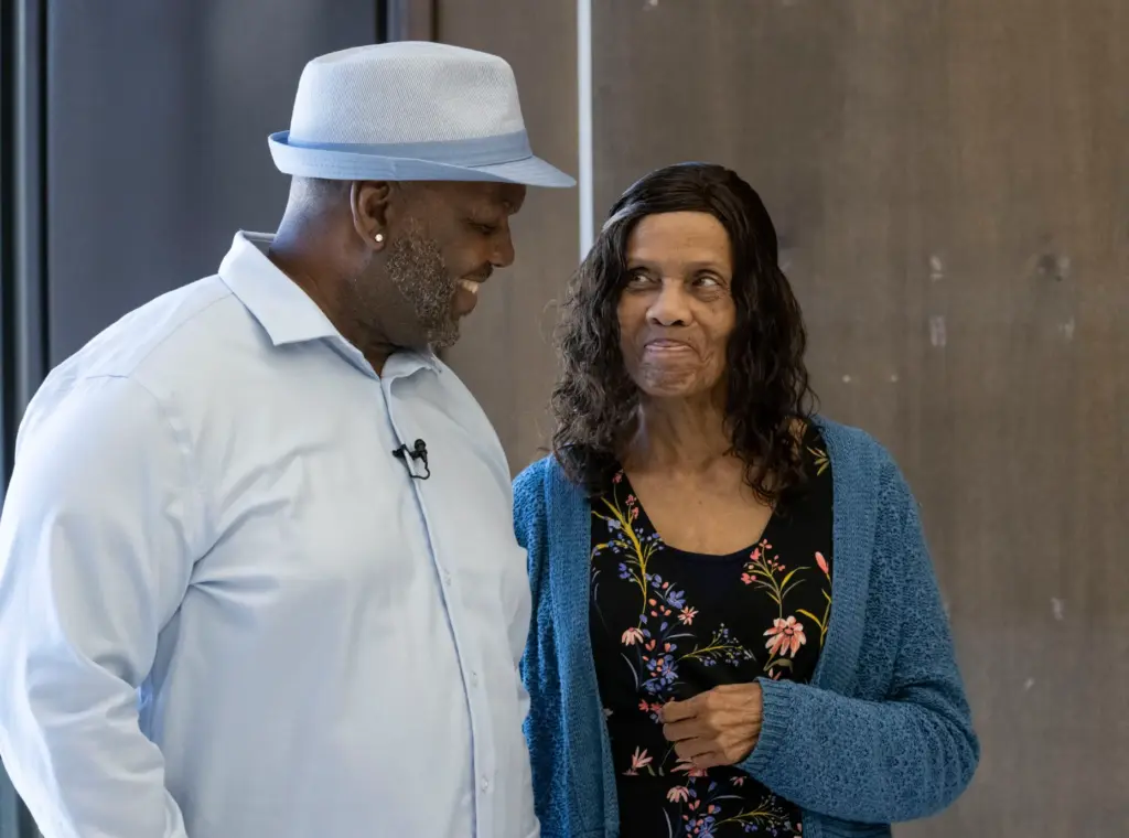 Guy Miles shares a smile with his mom, Mabel Miles,...