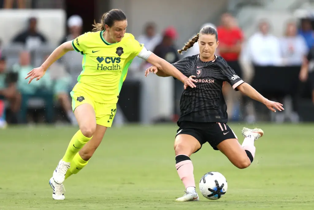 Angel City FC midfielder Ally Sentnor, right, winds up to...