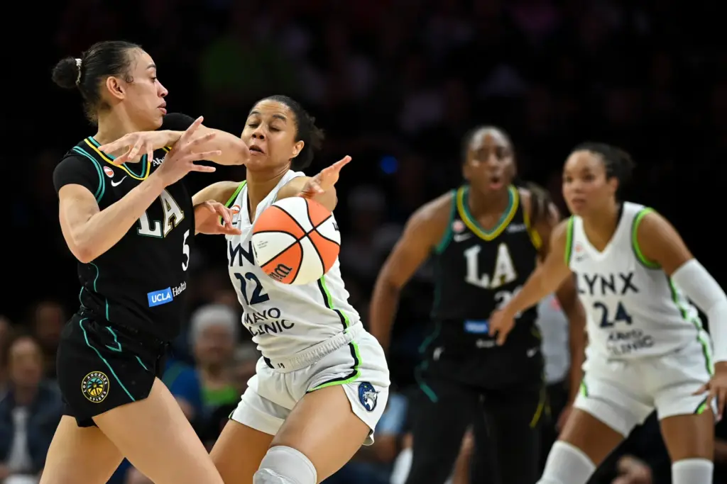 Minnesota Lynx forward Nia Coffey, right, knocks the ball away...