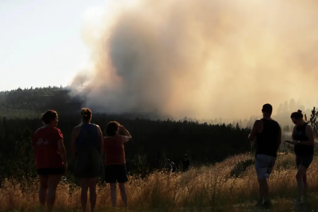 People watch Old Trails Fire in Spokane, Washington.