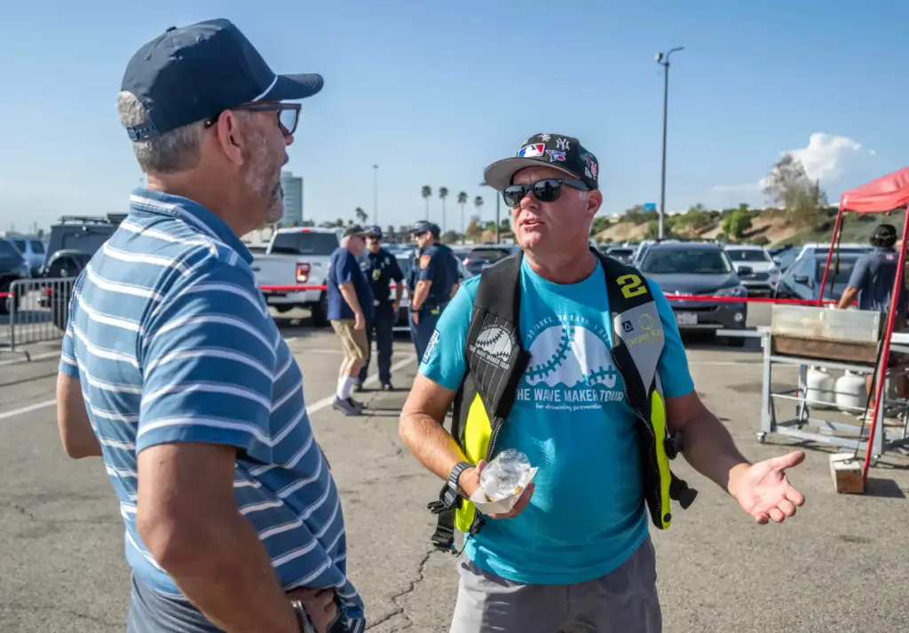 Jonathan St. Clair of Orange, right, who is attending 30...