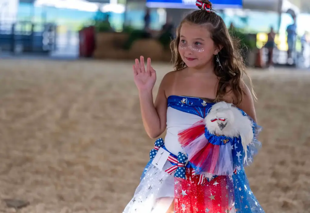 Addison Nichols, 10, of Mission Viejo walks with her chicken,...