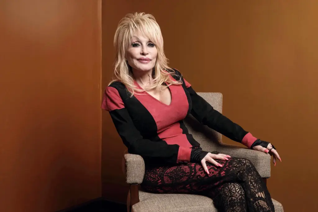 FILE – Dolly Parton poses at the Carnegie Medal of...