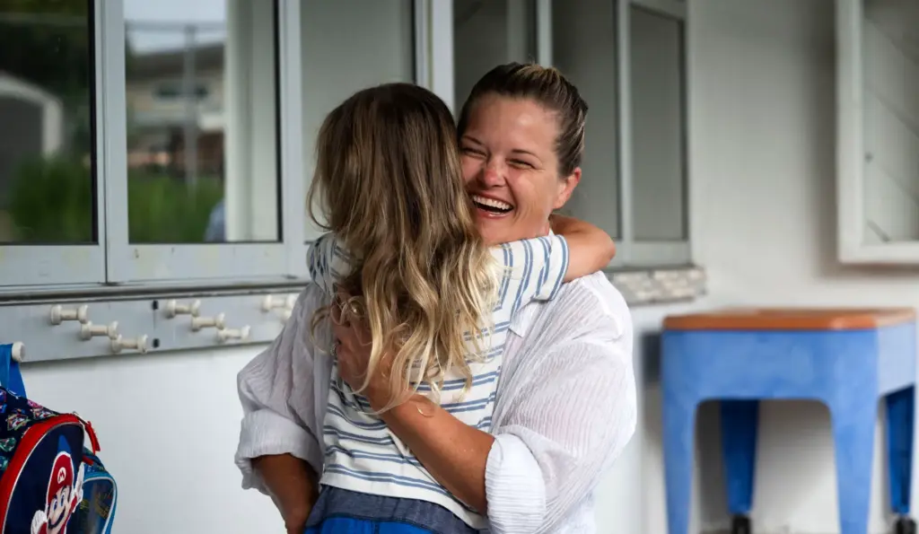 Jordan Gough gets a hug from his mom Betsy on...