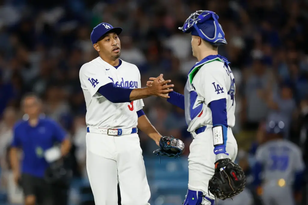 Dodgers relief pitcher Edwin Diaz, left, and catcher Hunter Feduccia...