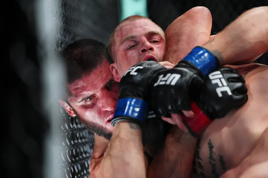 Islam Makhachev, left, and Ian Machado Garry battle in a...