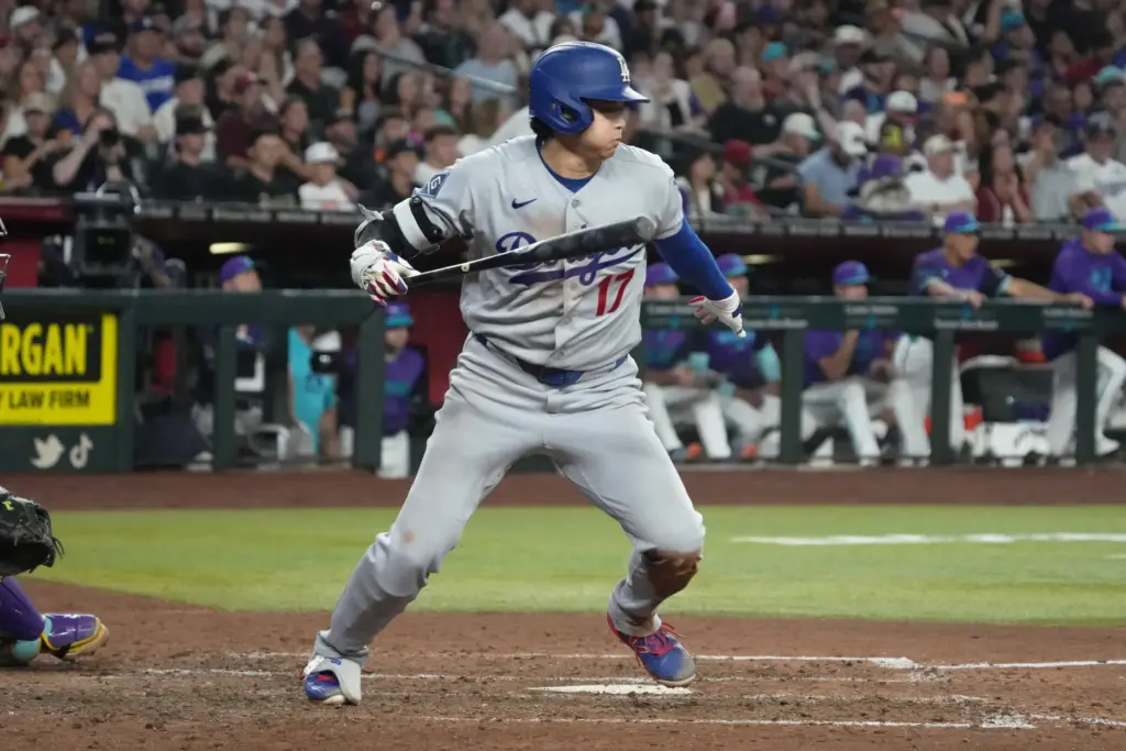 Dodgers star Shohei Ohtani hits into a double play in...