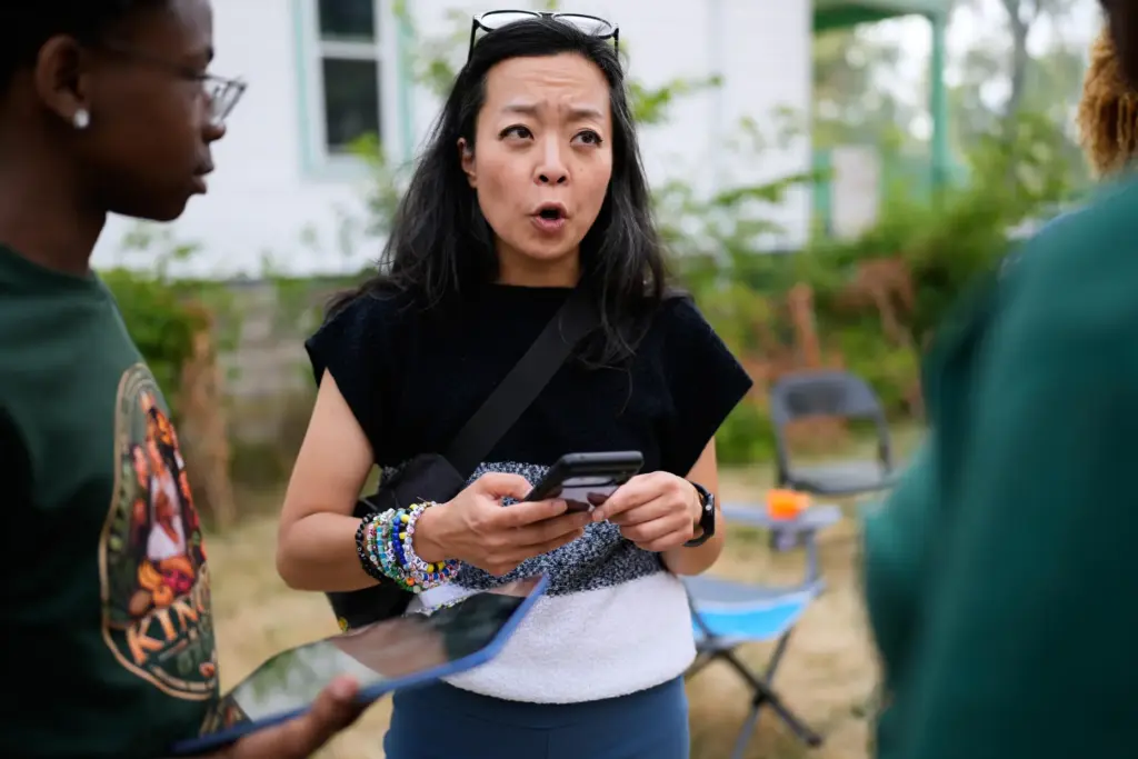 Democratic gubernatorial candidate Francesca Hong talks with Milwaukee residents during...