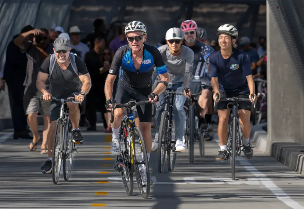Bicyclists lead the way over the Jeffrey Open Space Trail...