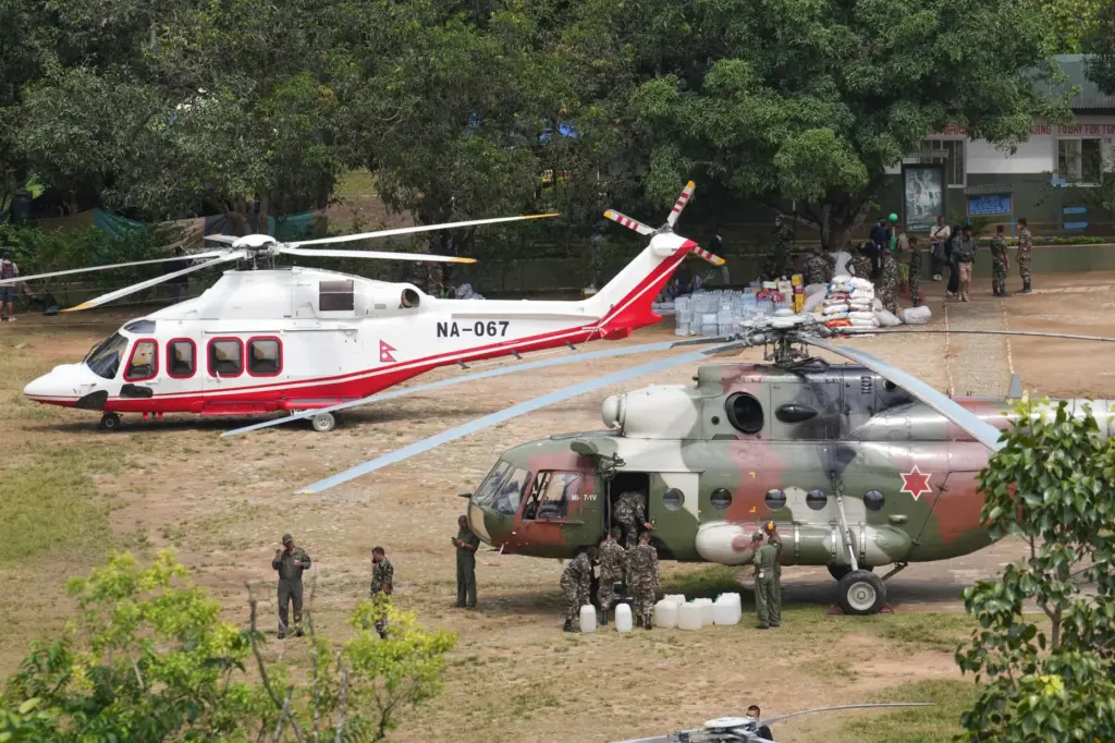 Private and military helicopters are deployed to rescue people.