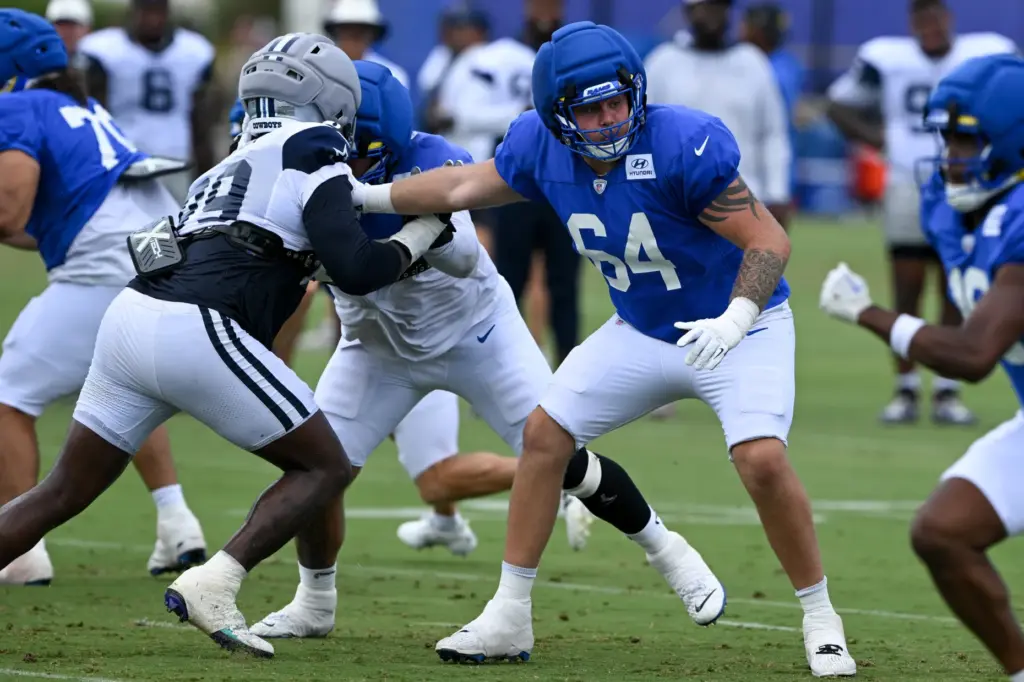 Rams offensive lineman Austin Blaske works on pass protection during...