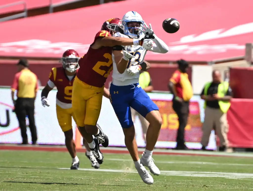 Cornerback RJ Sermons (21) of the USC Trojans knocks away...