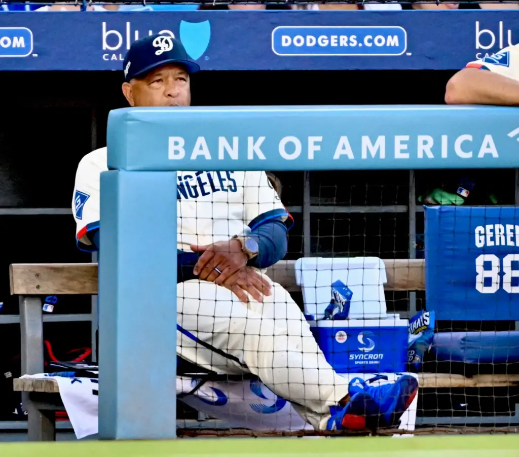 Dave Roberts of the Dodgers looks on against the Milwaukee...