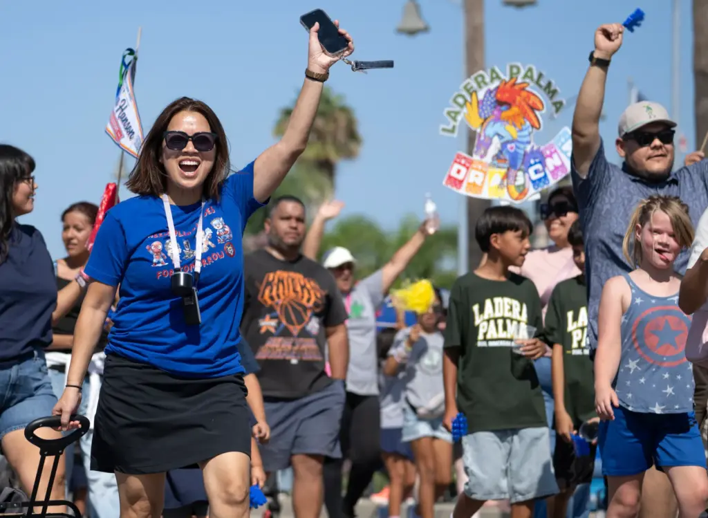 Representatives for the La Habra City School District walk in...