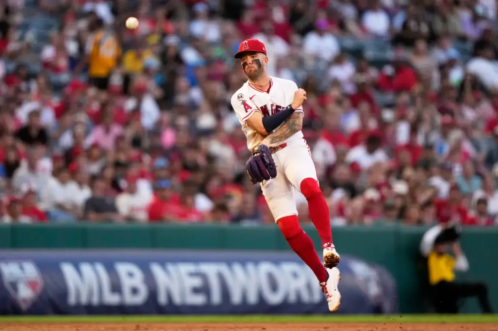 Angels shortstop Zach Neto throws out the Philadelphia Phillies’ Bryan...