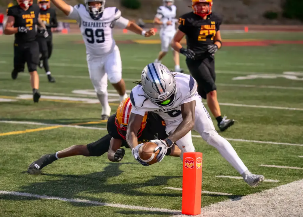Chaparralâs Kingston Hunter, right, gets past Mission Viejo cornerback Jojo...