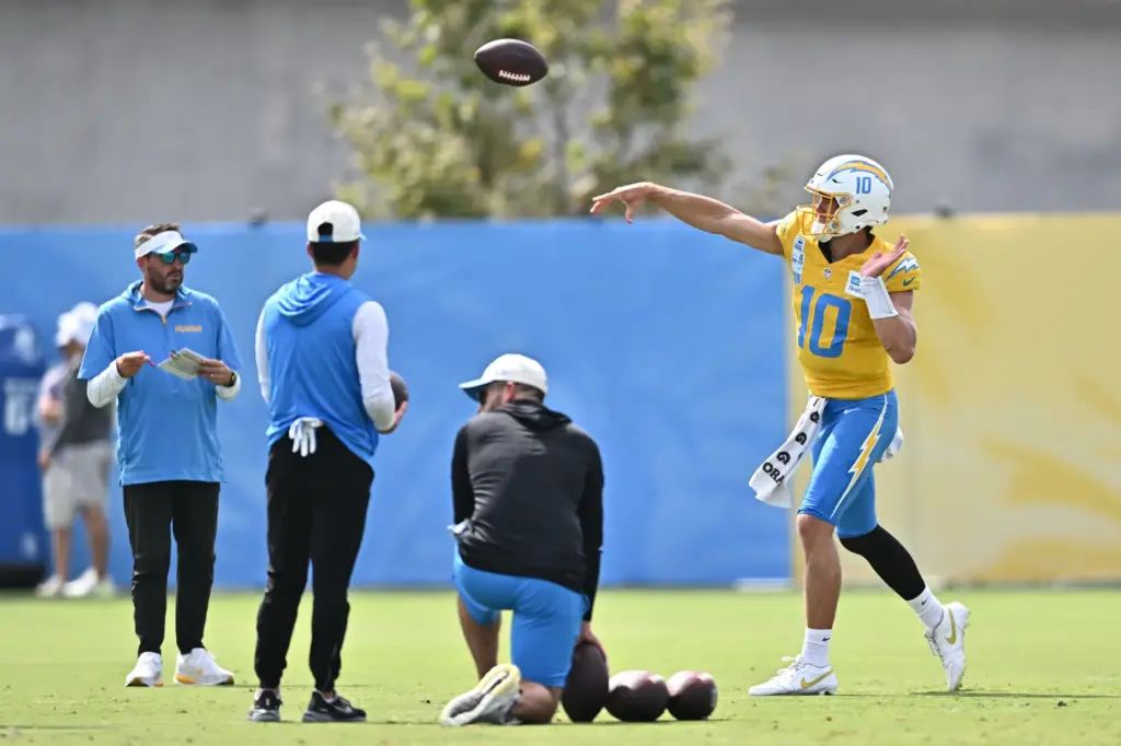 Chargers quarterback Justin Herbert throws a pass during a training...