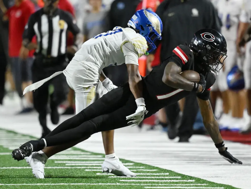 Centennial wide receiver Quentin Hale (1) makes the first catch...