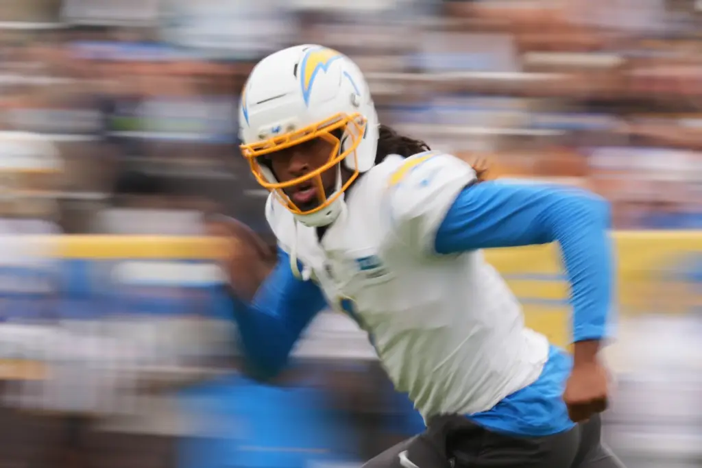 Chargers wide receiver Quentin Johnston runs a route during an...