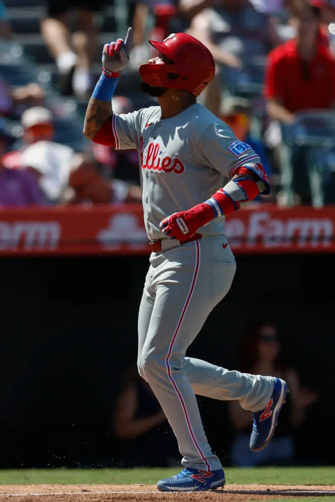 Philadelphia Phillies’ Edmundo Sosa rounds the bases after hitting a...