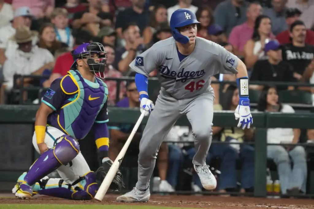 The Dodgers’ Hunter Feduccia begins to run after putting the...