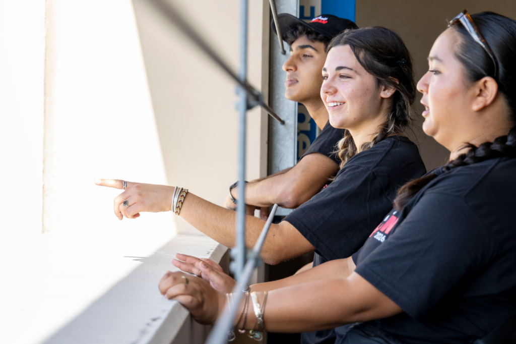 From the left, Orientation Leaders Shishir Gomatham, Sierra Madigan and...