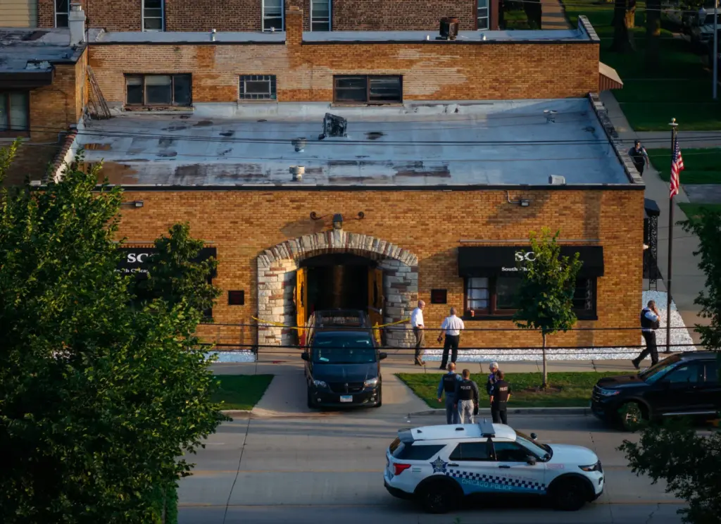 Officials work outside South Chicago Chapel funeral home where dozens...
