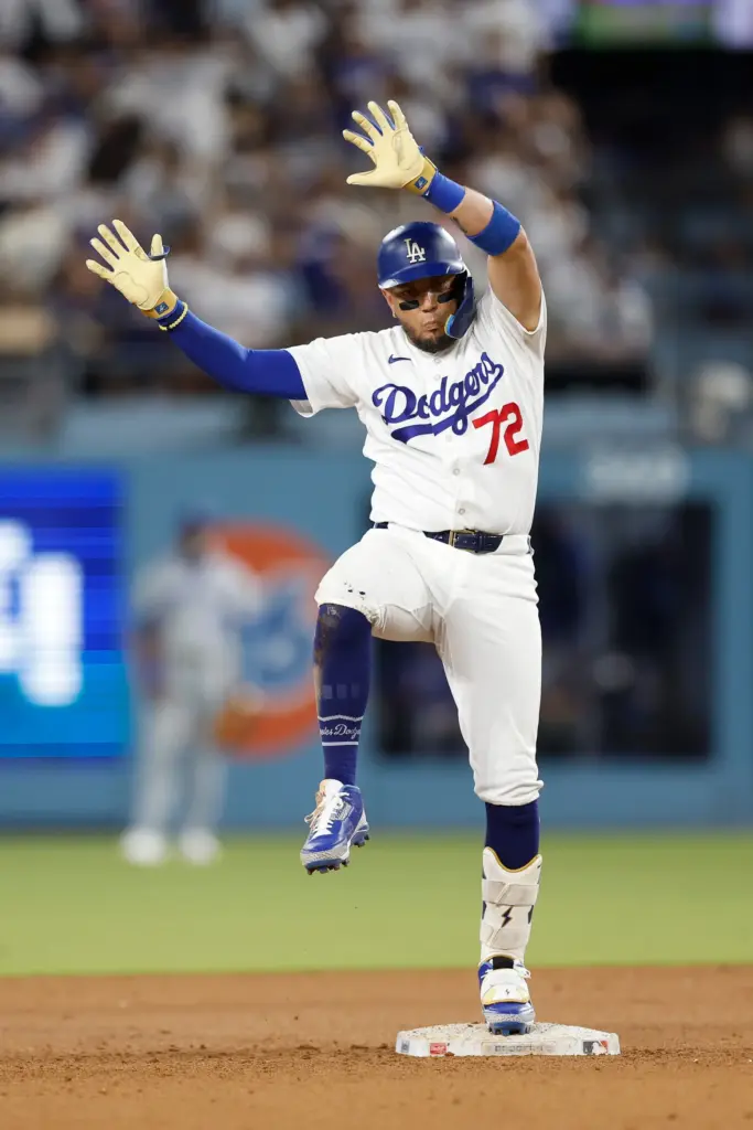 The Dodgers’ Miguel Rojas reacts after hitting a double during...
