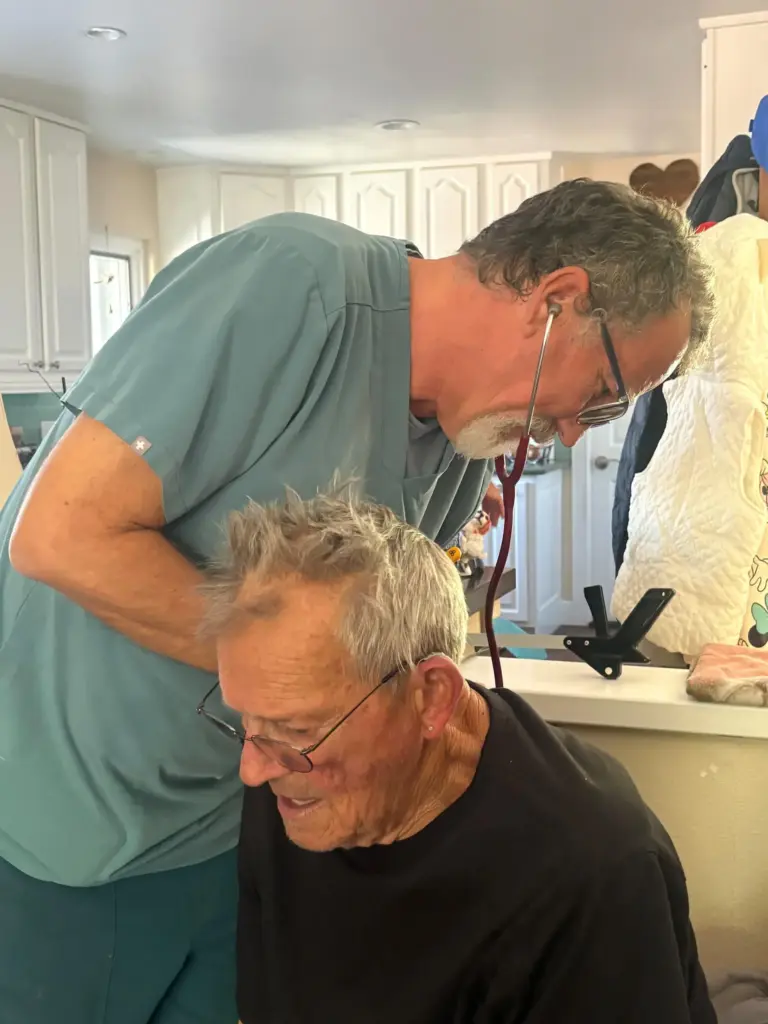 Hospice nurse Blake Knier listens to Mark Vantreaseâs lungs. (Laurie...